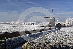 Dutch windmill in a winter landscape