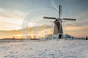 Dutch windmill in wintertime photo
