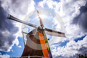 Dutch windmills with dramatic cloudy sky.
