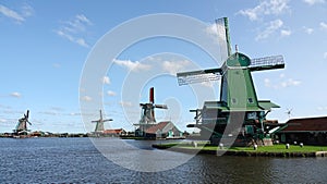 Dutch Windmills on the Zaan river at the Zaanse Schans in Zaandam, the Netherlands photo