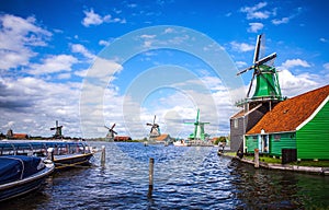 Dutch windmills in Zaandam with dramatic cloudy sky