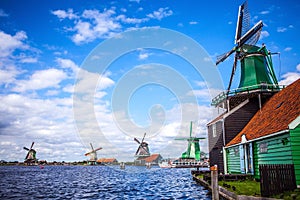 Dutch windmills in Zaandam with dramatic cloudy sky