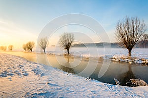 Dutch winter landscape during sunrise