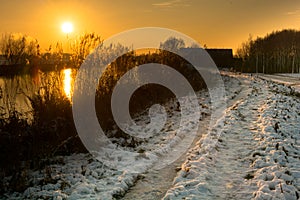 Dutch winter landscape with sunset