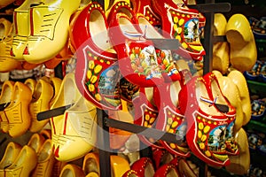 Dutch wooden shoes in the souvenir shop. Red and yellow Clog and