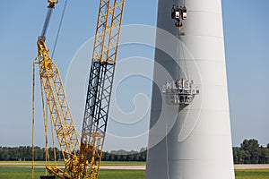 Dutch workers busy with the constuction of a new windturbine