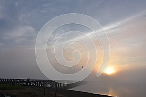 Duxbury`s Powder Point Bridge in the Fog at Sunrise