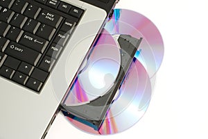 DVD or CD being loaded into laptop