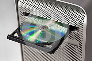 DVD CD ROM on a computer opened to show disc