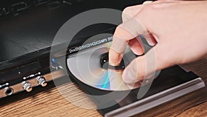 DVD Compact Disc is Inserted Into The Player