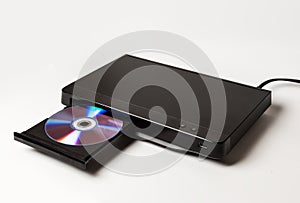 DVD player ejecting disc isolated on white photo