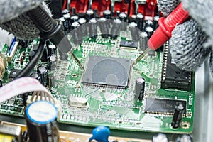 DVD Player motherboard repair close-up, electronic hardware concept.