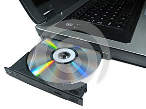 DVD ROM on a laptop opened to show disc. Isolated.