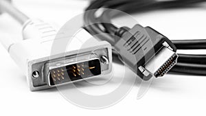 DVI and HDMI plugs, cables closeup on white