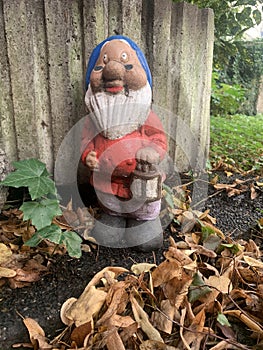 Dwarf with lamp in the garden