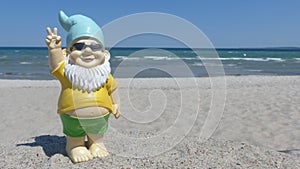 Dwarf with sunglasses seaside makes peace sign