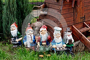 Dwarfs decorate the garden near the house. Sculptures fabulous dwarves. photo