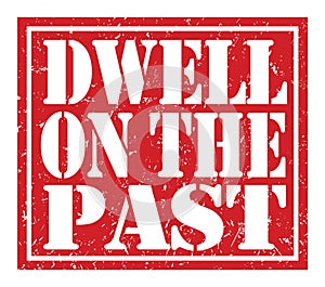 DWELL ON THE PAST, text written on red stamp sign photo