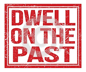 DWELL ON THE PAST, text on red grungy stamp sign photo