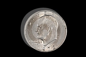 A Dwight Eisenhower American one dollar coin isolated on black photo