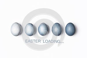 Dyed blue gradient Easter eggs row, Easter loading concept.