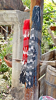 Dyed ikat thread hanging to dry photo