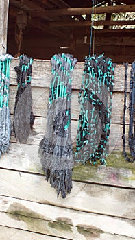 Dyed ikat thread hanging to dry photo