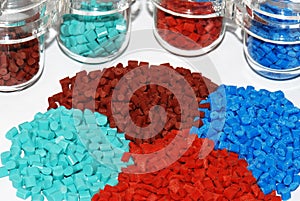 Dyed plastic granulate in test glasses