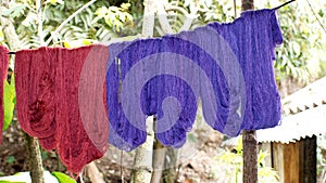 Dyed thread hanging to dry photo