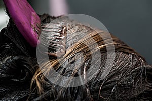 Dying blond hair to black