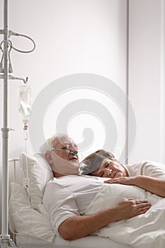 Dying husband in hospital bed