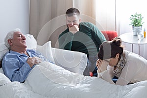 Dying man lying in bed