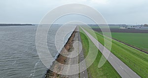 Dyke road infrastructure in The Netherlands, Holland. Flood barrier along the Ijselmeer near Lelystad and Urk. Water and