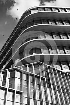 Dynamic black and white shot of modern architecture with striking geometric patterns and contrasting shapes