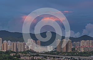 Dynamic cloud over residential district of Hong Kong at dusk