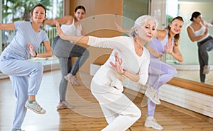 Dynamic elderly woman dancing hip-hop