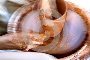 Dynamic image with blur of a pot being thrown