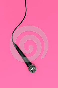 Dynamic microphone on pink background. Mic