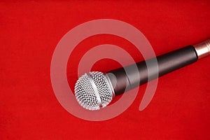 Dynamic microphone on red floor for music