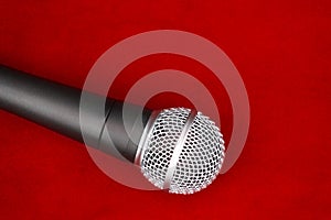 Dynamic microphone on red floor for music