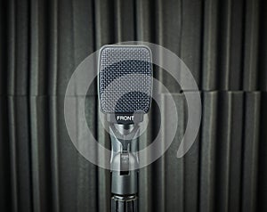 dynamic microphone for vocals and choirs mounted on stand photo