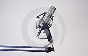 Dynamic podcast microphone isolated with a white background