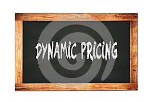 DYNAMIC  PRICING text written on wooden frame school blackboard photo