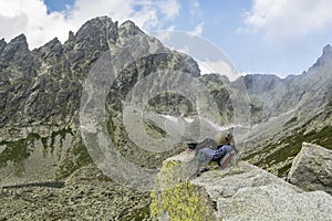 Dynamic rope, helmet, carabiners, climbing harness and descender on the rock in Tatra Valley