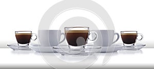 A dynamic row of glass and white expresso cups and saucers full of smooth expresso coffee, on a white style bar or table top with