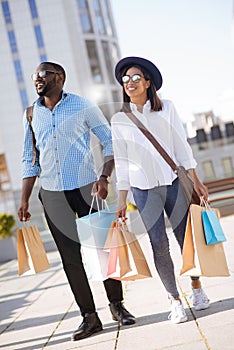 Dynamic stylish couple going for shopping together