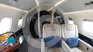 Dynamic walk through a luxury private jet with luxury interior during flight