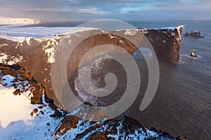 Dyrholaey rock formation at sunset. Dyrholaey is a promontory located on the south coast of Iceland, not far from the village Vik