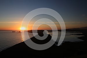 Dyrholaey rock formation at sunset, Iceland