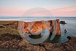 Dyrholaey rock formation at sunset